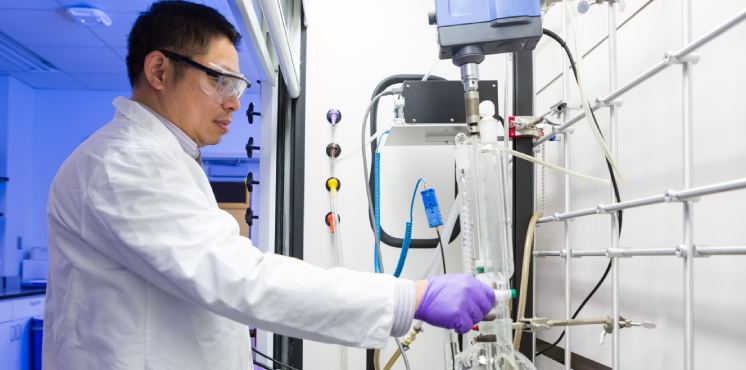 scientist working with equipment
